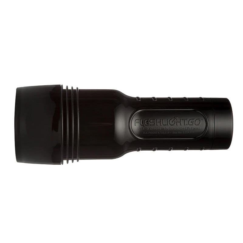 Black Fleshlight GO with cap on laying horizontally