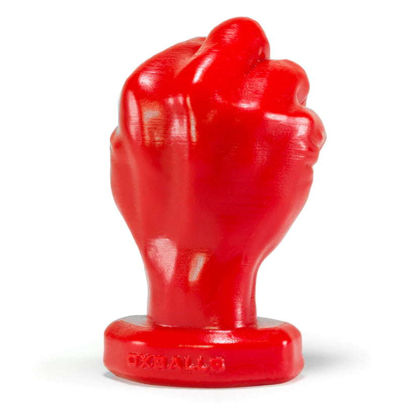 Back view of a red butt plug shaped like a fist on a white background