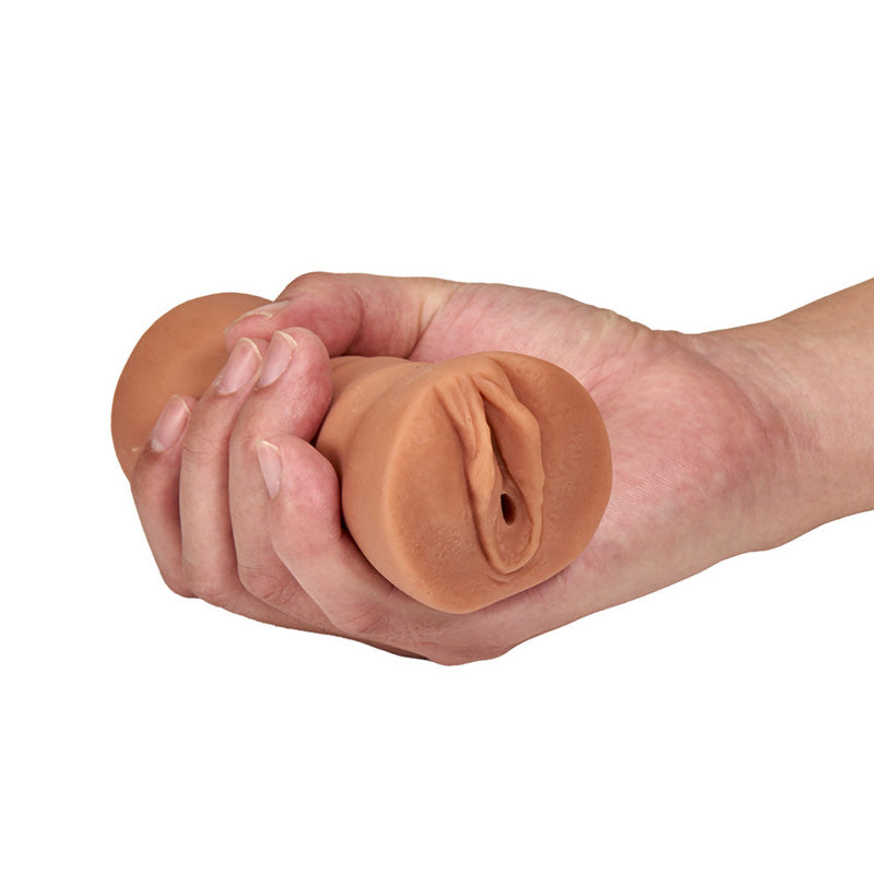 Hand holding Blush BL-73517 M For Men Julieta Mocha Vibrating Pussy Stroker