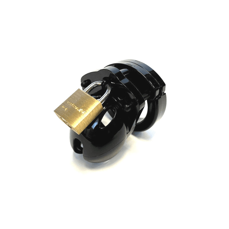 Black CB-X Mini-Me 1.25" chastity device with a gold lock on a white background