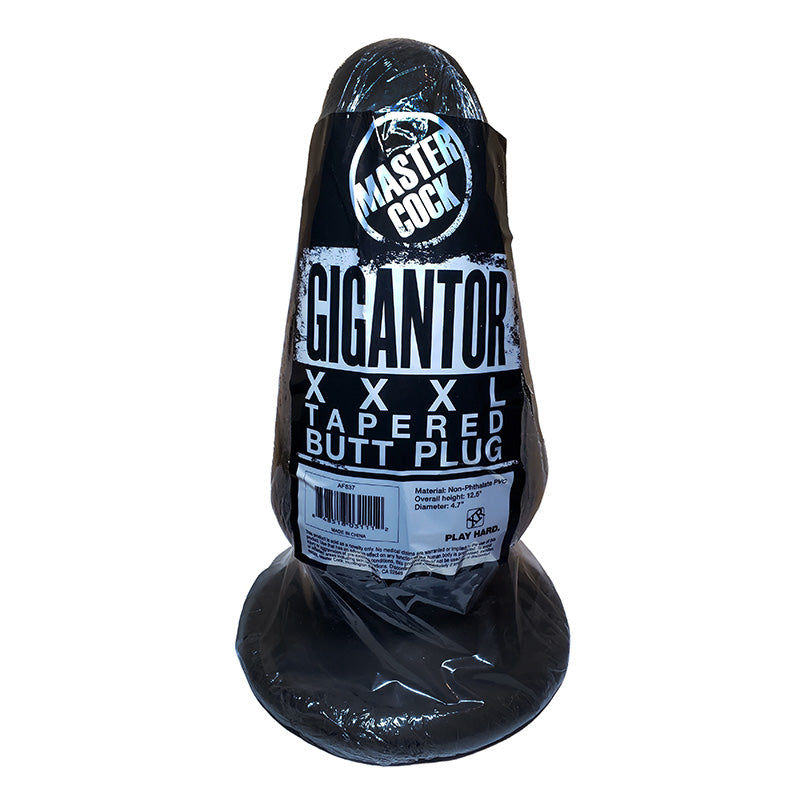 Large black butt plug with 'Master Cock Gigantor XXXL Tapered Butt Plug' text on a white background