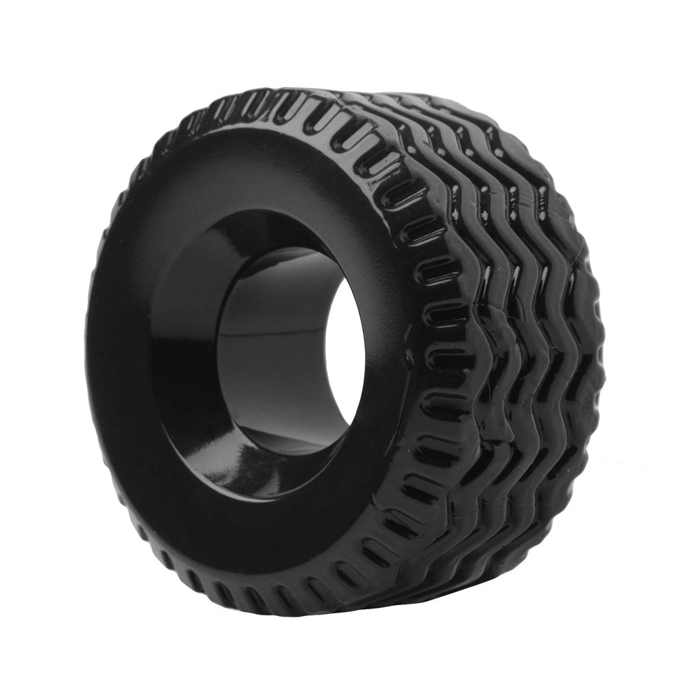 Black tire-style cock ring with heavy tread on a white background