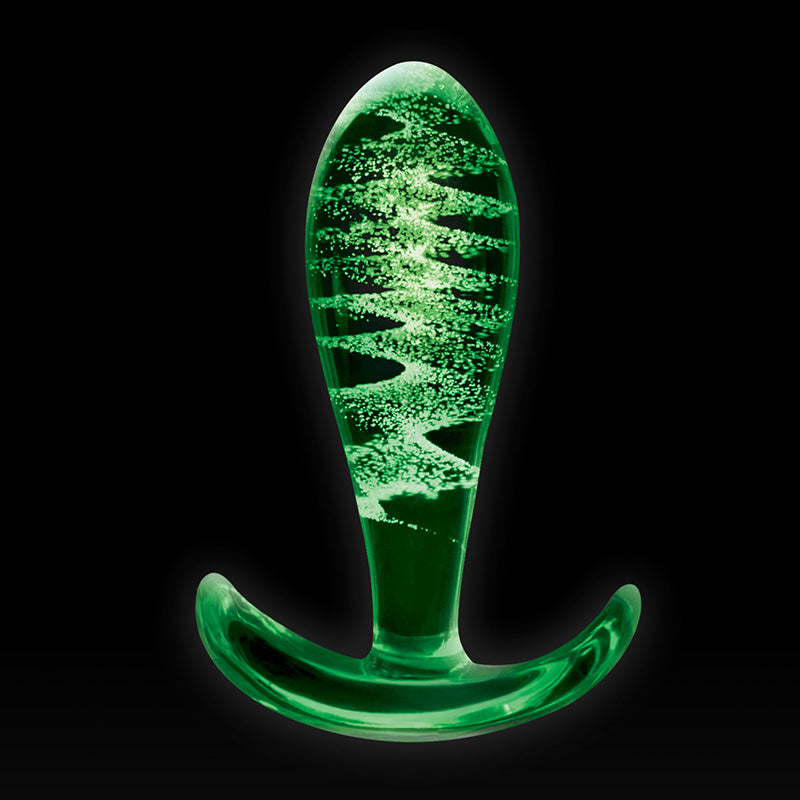 NS Novelties NSN-0491-51 Firefly Glass Ace butt plug glowing green on a black background