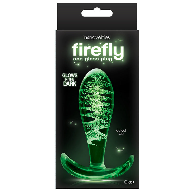 Product packaging for Firefly Ace Glass Plug with a glass butt plug glowing green on a dark background with text 'glows in the dark' and nsnovelties branding
