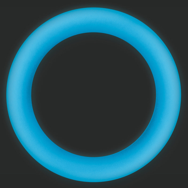 Large blue Firefly Halo glow-in-the-dark cock ring glowing on a dark background