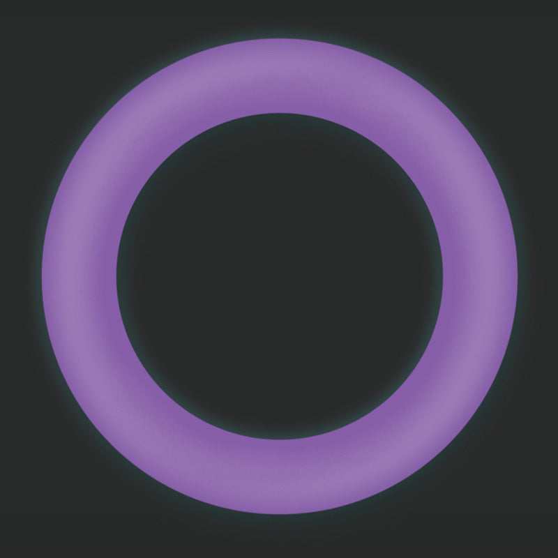 Medium purple Firefly Halo glow-in-the-dark cock ring glowing on a dark background