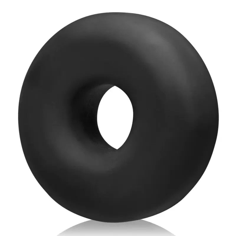 Angled view of a Oxballs Bix Ox Black Ice cock ring on a white background