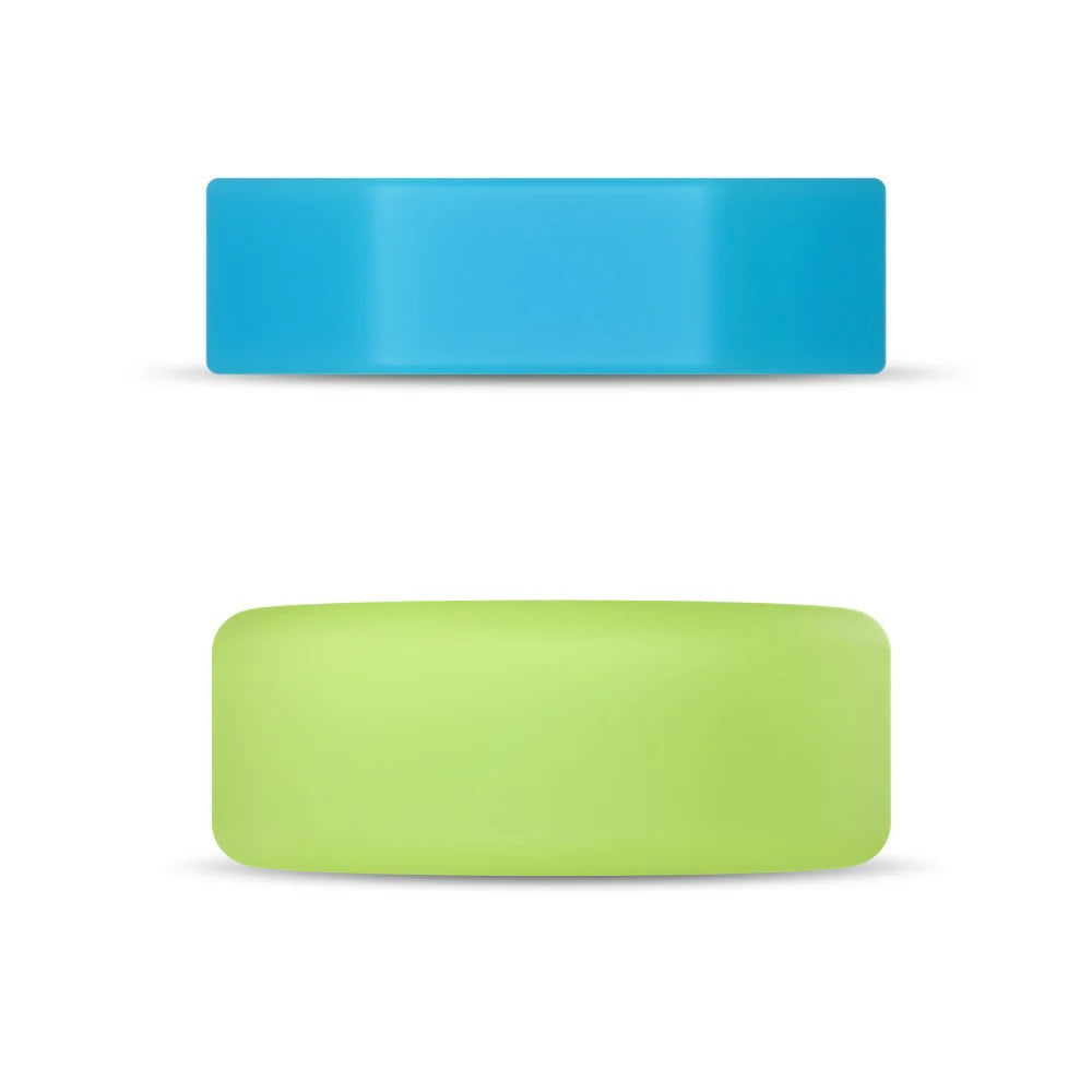 Side view of green round and blue hexagonal objects on a white background