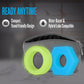 Two silicone rings, one green and one blue, in front of a gray pouch with text about compact design and compatibility.