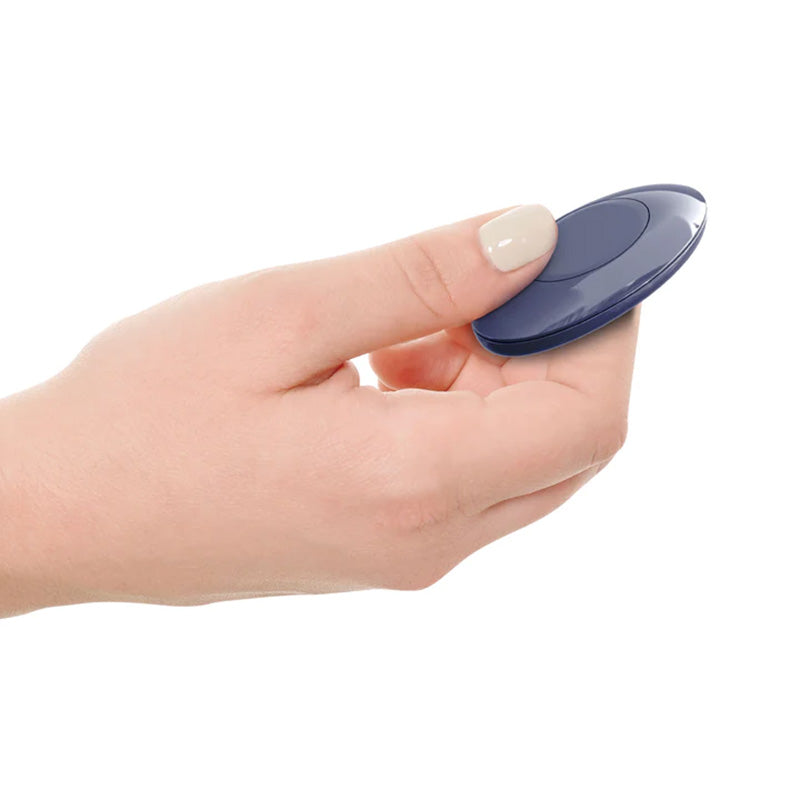 Hand holding a blue oval remote control for a 3Some Wall Banger P-Spot vibrating prostate massager on a white background