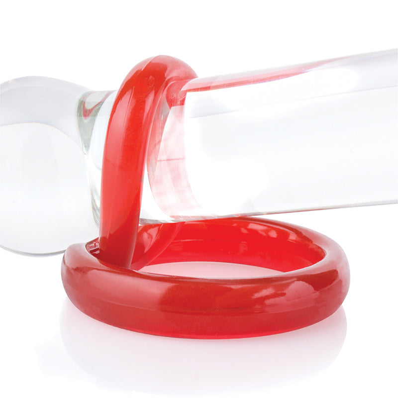 Red cock and ball ring over a clear shaft on a white background